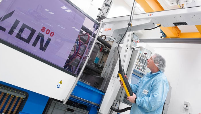 Employee in cleanroom environment