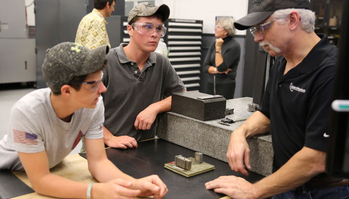 School of tech - students and teacher