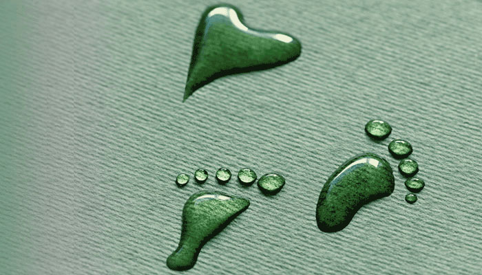 Footstep in water on green background