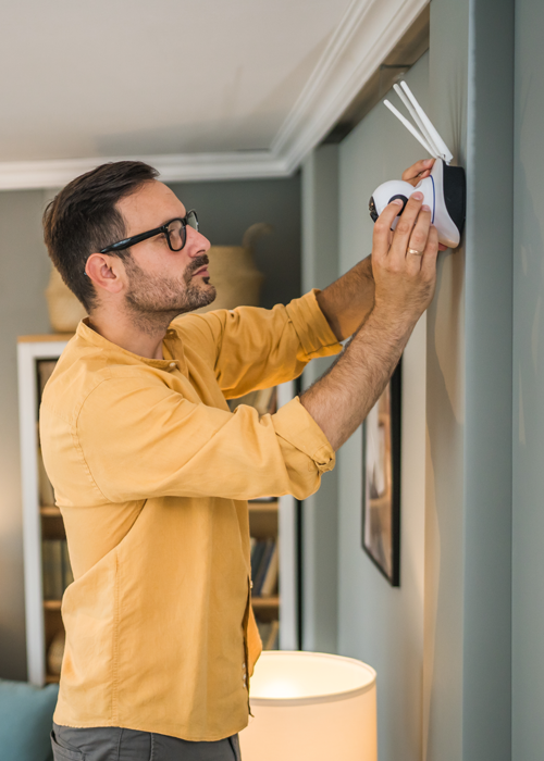 Man mounting a security device