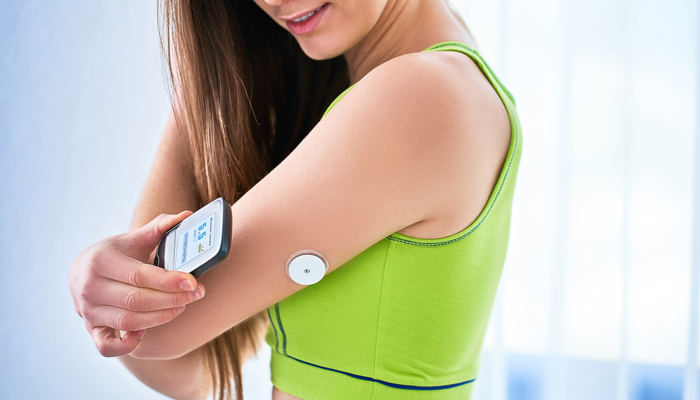 Woman with a digital insulin injector