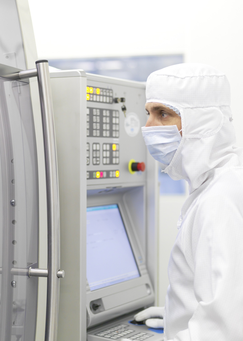 Employee in clean room production