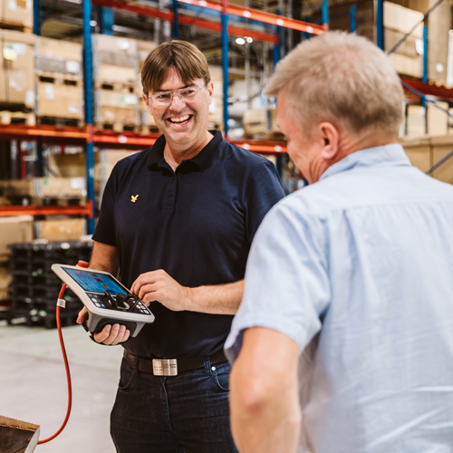 Nolato Polymer employees talking to each other.