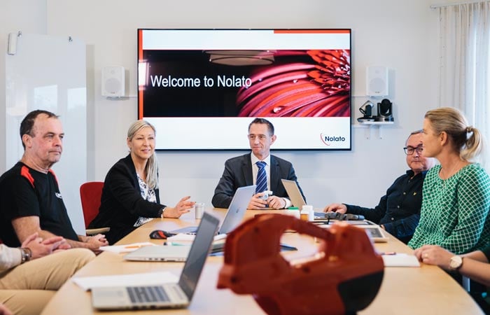 Nolato- employees in conference room